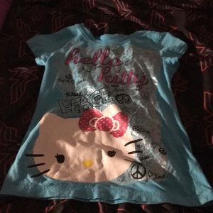 A blue short sleeved- T-shirt . M(7/8) in girls